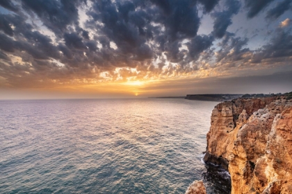 Picture of DRAMATIC SUNSET CLOUDS OVER CLIFFS ALONG THE COAST AT PONTA DA PIEDADE IN LAGOS-PORTUGAL