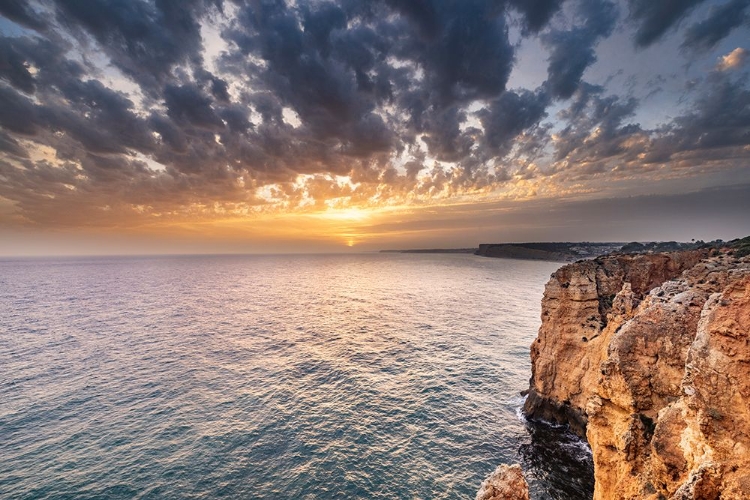 Picture of DRAMATIC SUNSET CLOUDS OVER CLIFFS ALONG THE COAST AT PONTA DA PIEDADE IN LAGOS-PORTUGAL