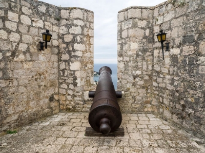 Picture of CROATIA-HVAR. CANNON OVERLOOKING THE TOWN AND COASTLINE FROM HVAR FORTICA OR SPANJOLA FORTRESS.