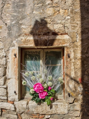 Picture of CROATIA-ROVINJ-ISTRIA. COLORFUL BOUQUET OF FLOWERS DECORATE AN OLD WINDOW.