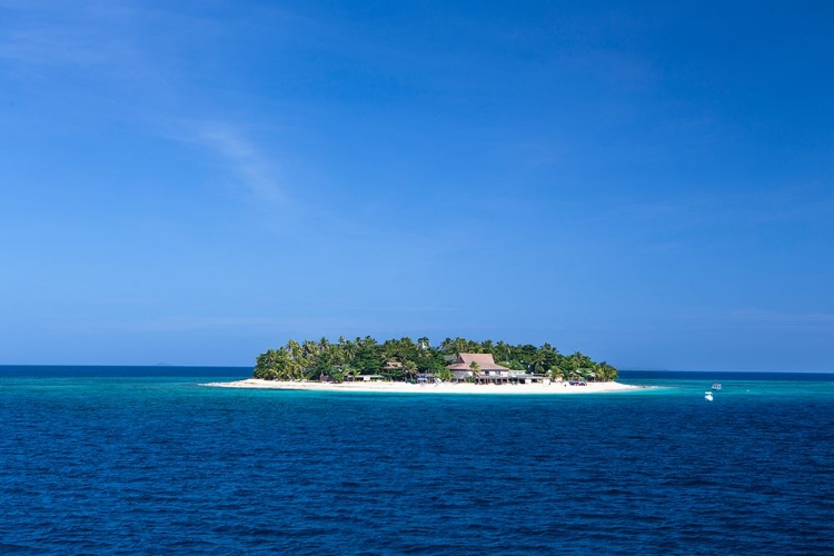 Picture of FIJI. BOATS HEAD TOWARDS BEACHCOMBER ISLAND-IN THE MAMANUCA ISLAND CHAIN.