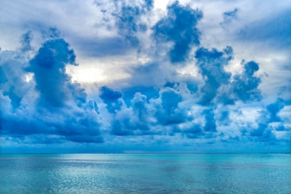 Picture of CLOUDSCAPE-MOOREA-TAHITI-FRENCH POLYNESIA. BLUE COLORS IN WATER IN LAGOON AND CORAL REEFS