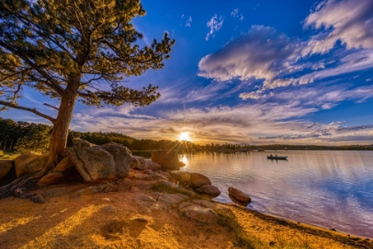 Picture of USA-COLORADO-DOWDY LAKE. SUNSET ON LAKE AND PEOPLE FISHING IN BOAT.