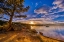 Picture of USA-COLORADO-DOWDY LAKE. SUNSET ON LAKE AND PEOPLE FISHING IN BOAT.