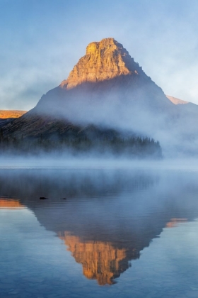 Picture of SINOPAH MOUNTAIN AND FOGGY SUNRISE OVER TWO MEDICINE LAKE IN GLACIER NATIONAL PARK-MONTANA-USA
