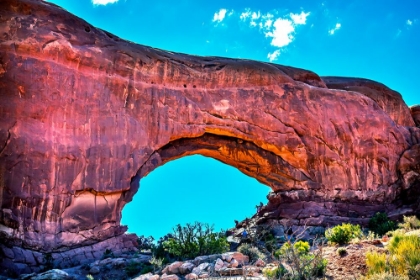 Picture of NORTH WINDOW ARCH WINDOWS SECTION ARCHES NATIONAL PARK-MOAB-UTAH. RED CANYON WALLS-BLUE SKIES.