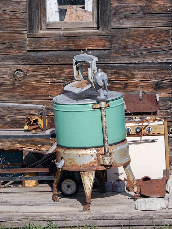 Picture of AN OLD WASHING MACHINE AND OLD RUSTY STOVE ON THE PORCH OF A BUILDING IN GHOST TOWN.