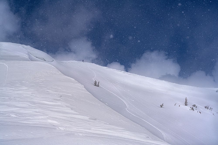 Picture of WYOMING. MAN GETTING READY FOR DESCENT OF MOUNT TAYLOR-HIGHEST PEAK IN SOUTHERN TETON MOUNTAINS