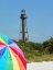 Picture of SANIBEL LIGHTHOUSE WITH UMBRELLA