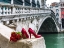Picture of BUNCH OF RED ROSES AND RED HIGH HEEL SHOES, RIALTO BRIDGE, VENICE, ITALY