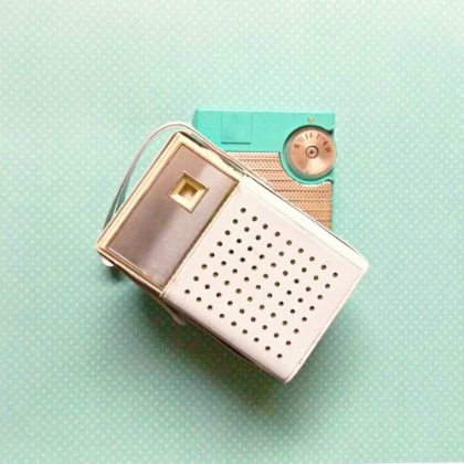 Picture of VINTAGE TRANSISTOR RADIO ON BLUE